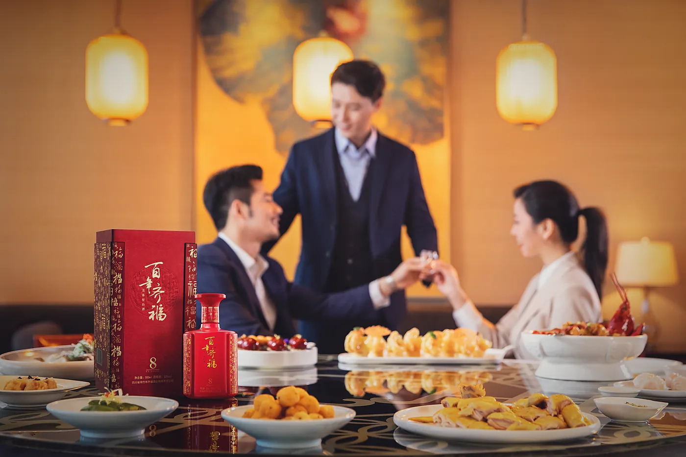 A host pouring baijiu for a guest at a Chinese banquet table